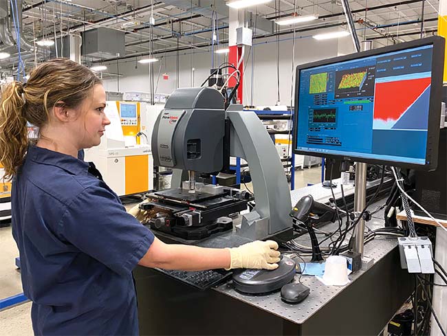 A student at Sussex County Community College (SCCC) measures the surface roughness (texture) of an optic using a ZYGO NewView 3D optical surface profiler (right). Courtesy of Thorlabs.