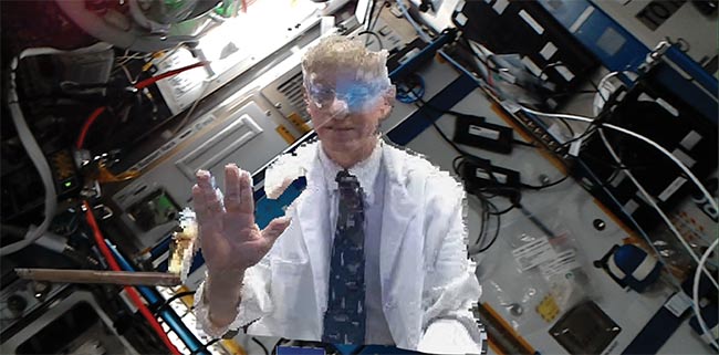NASA flight surgeon Dr. Josef Schmid gives a Vulcan salute while being holoported aboard the International Space Station. Image courtesy of Thomas Pesquet/European Space Agency.