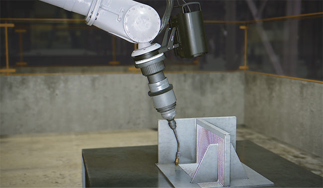 A smart camera mounted on the end of a robot arm guides an automated welding process. The camera uses structured light, projecting a pattern of light and dark lines, to determine 3D information. Courtesy of ADLINK Technology.