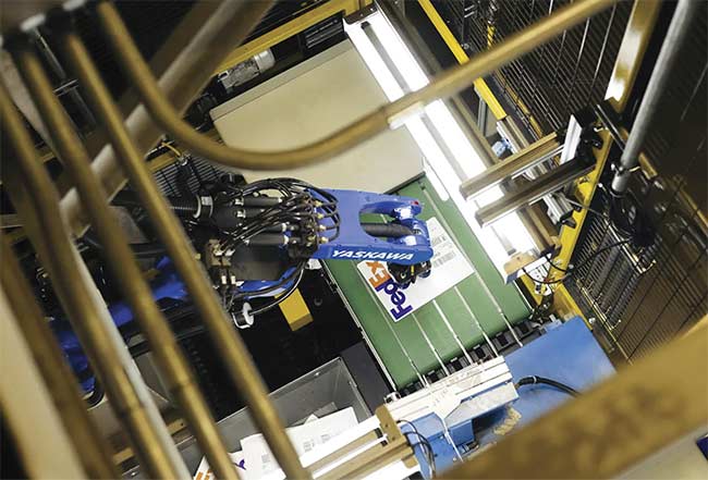 A sealed package, often with an attached barcode label, is a common item that robotic arms are required to process in logistics environments. Courtesy of Yaskawa Motoman.