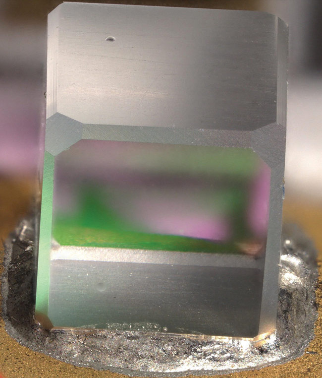 Figure 3. A mirror joined to a metalized surface via flux-free soldering to improve stability and stiffness over a wide thermal range. Courtesy of Menlo Systems.