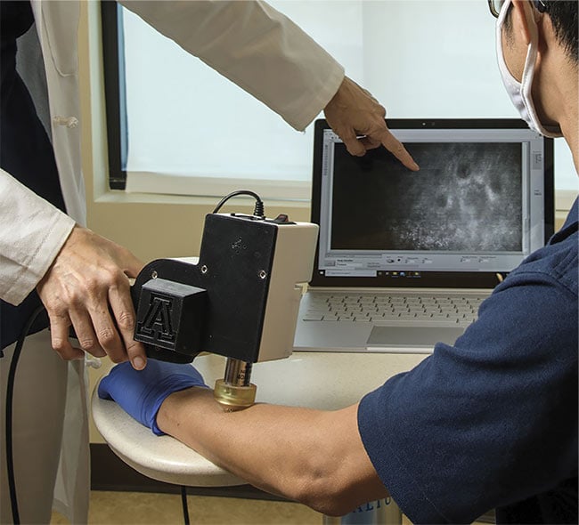 Portable reflectance confocal microscopy (RCM) can aid in the noninvasive diagnosis of various human diseases in both low- and high-resource health care settings. Courtesy of Kris Hanning/University of Arizona Health Sciences.