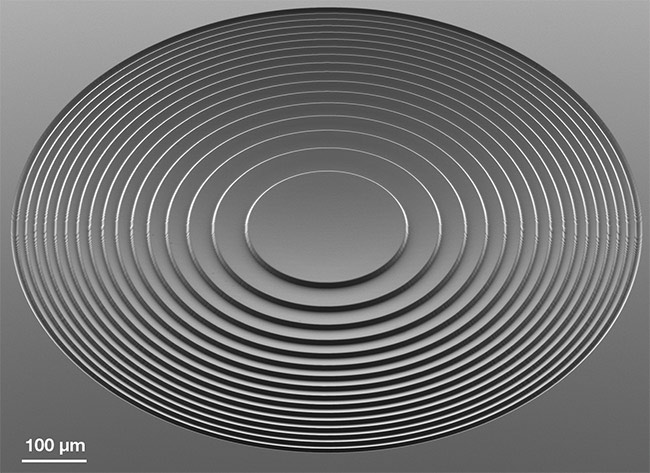 A concave spherical Fresnel lens with a height of 10 µm, a radius of curvature of 840 µm, and an effective diameter of 1 mm. Written with a Heidelberg Instruments DWL 66+ laser lithography tool. Courtesy of Heidelberg Instruments.