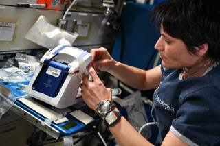 ESA Astronaut Samantha Cristoforetti operates the rHEALTH analyzer on the International Space Station in May 2022. Courtesy of NASA. 