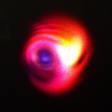 The researchers developed a way to transmit a femtosecond pulsed laser through a thick optical window and then used a process called laser-induced filamentation to expand it into a supercontinuum pulse that remains coherent. The image shows the range wavelengths in the expanded pulse. Courtesy of Alexis Bohlin, Luleå University of Technology.