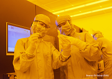 Process engineers examine a 200-mm wafer with metalenses replicated using a master manufactured by Toppan Photomask and a nanoimprint lithography (NIL) process from EVG. The companies are collaborating to establish NIL as an industry standard production process for photonics manufacturing. Courtesy EV Group.