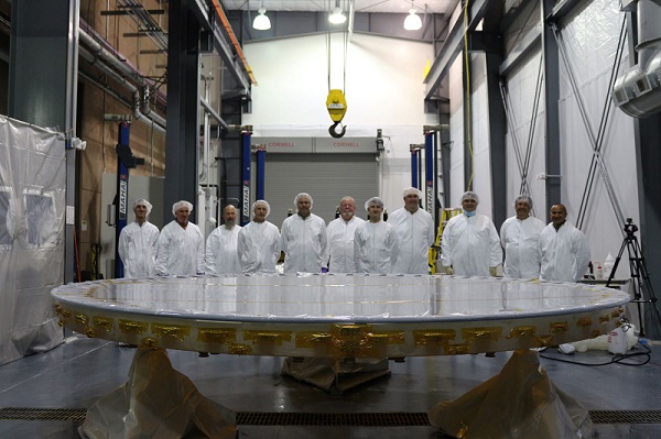 The Boeing team poses with the Advanced Electro-Optical System, or AEOS, primary mirror following a recoat at the Air Force Maui Optical and Supercomputing (AMOS) site, Maui, Hawaii. This was the second recoat of the mirror since AEOS’s initial installation in 1997. AMOS is part of the Air Force Research Laboratory, and the 3.6-meter AEOS telescope supports the U.S. Space Force’s space domain awareness mission. Courtesy of Boeing. 