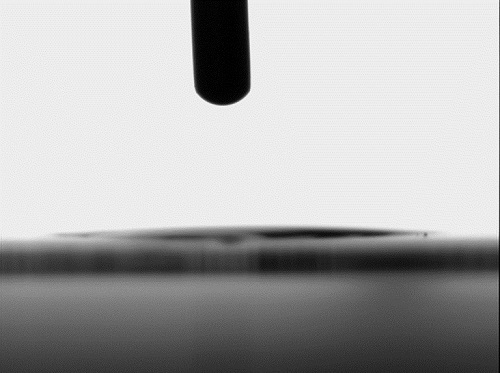The coated surface after irradiation with UV light for 30 minutes is superhydrophilic. The water droplet contact angle is now less than 5°. Courtesy of Fraunhofer FEP.