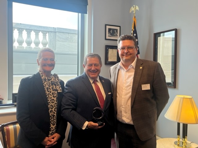From left: Optica public affairs rep. Amy Eskilson, Rep. Joseph D. Morelle, and Optica Chief Scientist P. Scott Carney. Courtesy of Optica.