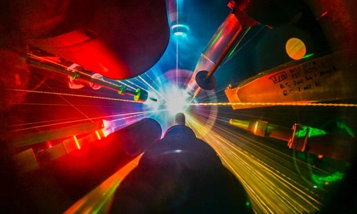 View from inside the OMEGA target chamber during a direct-drive inertial fusion experiment at the Laboratory for Laser Energetics, which is leading a new multi-institutional inertial fusion energy hub funded by the US Department of Energy. Courtesy of Eugene Kowaluk, University of Rochester Laboratory for Laser Energetics.
