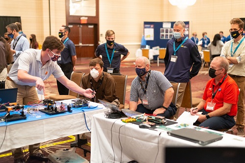 University Nanosat Program students present their work to reviewers from the Air Force Research Laboratory, NASA, Missile Defense Agency, and Space Dynamics Lab in Albuquerque, N.M., Aug. 15, 2021. Courtesy of Jesse Olson, U.S. Air Force.