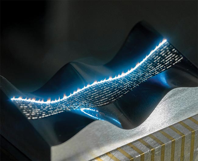 Figure 3. Surface texturing a complex shape using a five mechanical axis laser machine. Combining femtosecond laser technology with advanced motion control is enabling unprecedented accuracy when texturing the surfaces of different materials. Courtesy of Microrelleus.