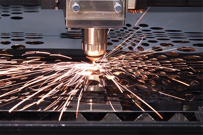 Laser cutting heads for ultrahigh-power laser systems must enable high duty cycles to maximize the return on investment of the instrument. This requires robust optics within the head. Courtesy of IPG Photonics.