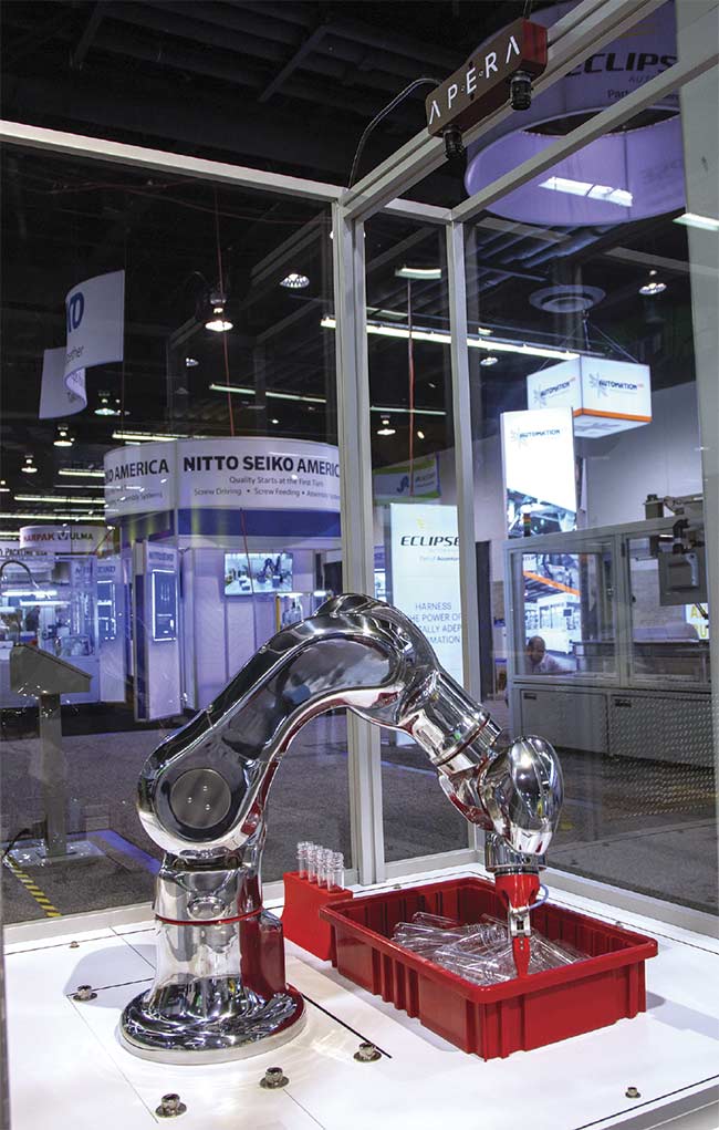 A pair of off-the-shelf 12-MP cameras focus on clear plastic tubes in an Apera AI vision system. Information from the cameras runs through AI-powered vision software and gives a Kawasaki cleanroom robot instructions to pick and place the object. Clear objects were previously a struggle for conventional vision solutions. Courtesy of Apera AI.