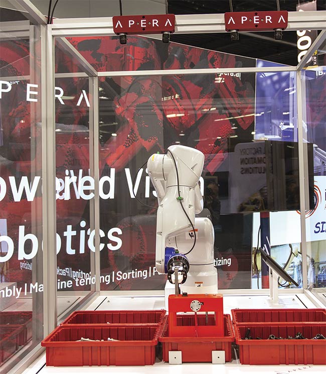 An Apera AI bin picking system using an Epson industrial robot. Two pairs of 12-MP cameras focus on four bins containing bolts of different sizes, colors, and degrees of shininess. AI-powered vision software guides the picking of the bolts and their vertical placement into a fixture. Courtesy of Apera AI.