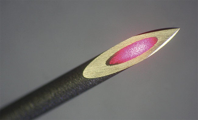 Fiber optics contained within a hypodermic needle can deliver targeted excitation of fluorescence to a tumor. Courtesy of SEDI-ATI.
