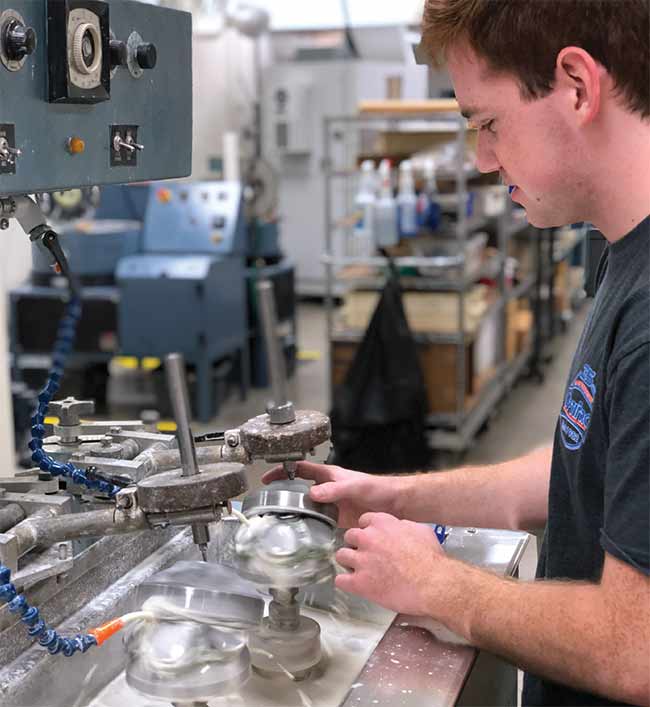 A Monroe Community College student practices conventional polishing. Courtesy of Monroe Community College.