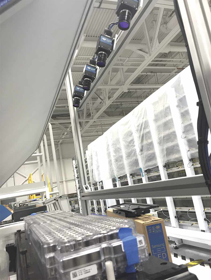 Four high-resolution cameras inspect an electric vehicle battery pack. AI improves the inspection performance. Courtesy of Tensor ID.