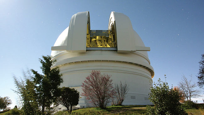 The Hale Telescope at Caltech’s Palomar Observatory in San Diego County, California, will receive the high-rate data downlink from the DSOC flight transceiver. The telescope is fitted with a novel superconducting detector that is capable of timing the arrival of individual photons from deep space. Courtesy of Caltech.