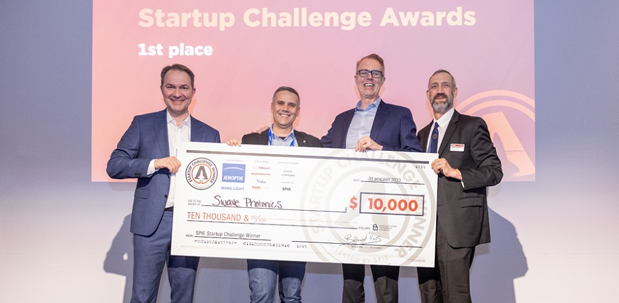 The challenge’s 2023 winner, Swave. From left to right: Jenoptik’s Ralf Kuschnereit, Swave Co-Founder Theo Marescaux, Swave CEO Mike Noonen, and 2023 SPIE Vice President Peter de Groot. Courtesy of SPIE.
