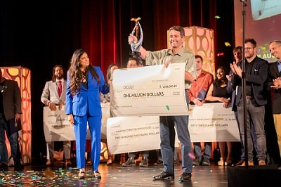 Oculi CEO Chardel Rizk accepts the $1 million prize for Company of the Year at the Luminate Finals 2023. Courtesy of Shannon Wojcik. 