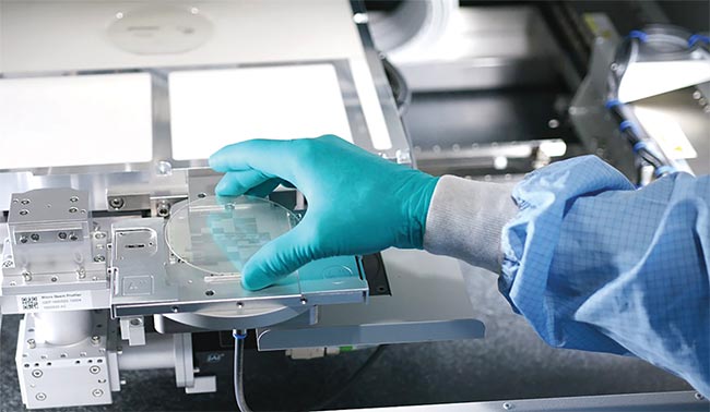 A view into a 3D-Micromac laser-induced forward transfer (LIFT) process module (bottom). The system enables the transfer of hundreds of millions of micro-LEDs. Courtesy of 3D-Micromac.