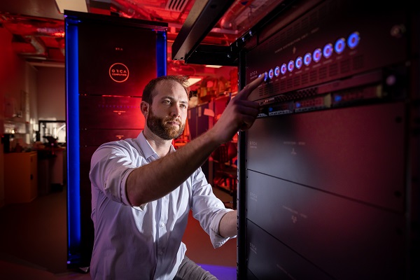 ORCA PT-1 computer in assembly room (shown). Quantum innovations from ORCA Computing, Pixel Photonics, Sparrow Quantum and the Niels Bohr Institute will unite to boost photonic quantum computing toward quantum supremacy. Courtesy of ORCA Computing via BusinessWire.