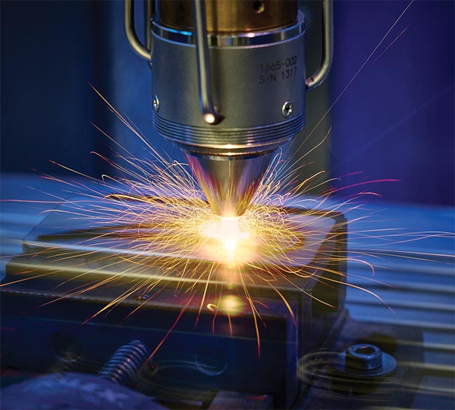 Figure 4. The extreme high-speed laser material deposition (EHLA) 3D process pioneered by Fraunhofer Institute for Laser Technology ILT (Fraunhofer ILT) is currently used in various applications (right). Beyond the 5-axis computer numerical control system, the method has additionally been transferred into a tripod kinematics with a stationary nozzle. Courtesy of Fraunhofer ILT.