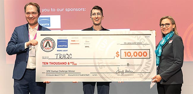 Benjamin Dringoli (left center), cofounder and CEO of TRAQC, poses with Jenoptik executive Ralf Kuschnereit (far left), and SPIE president Jennifer Barton after earning the top prize in the 2024 SPIE Startup Challenge. TRAQC develops nondestructive test technology for printed and additive electronics. Courtesy of SPIE.
