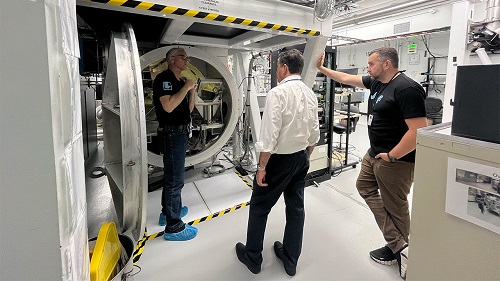 Lab employees and guests looking inside the target chamber of the three lasers at JLF. Courtesy of LLNL.
