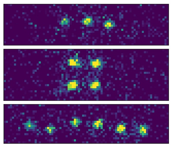 So far, the MPQ team has been able to manipulate up to six rubidium atoms as quantum bits in the optical resonator using the light tweezers. To make the atoms visible, the researchers excite them to emit light. In theory, the resonator can hold up to 200 atoms. Courtesy of the Max Planck Institute of Quantum Optics.