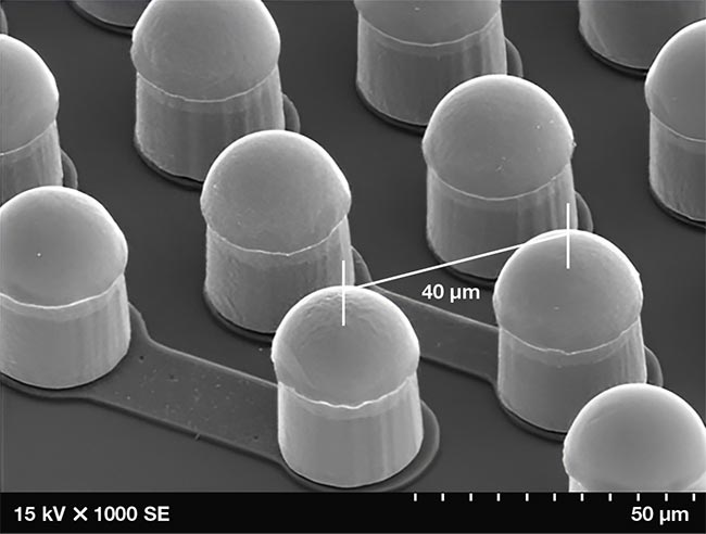 Wafer bumps under magnification, which serve as the connection between the chip and circuit board. Adapted with permission from Reference 2. Courtesy of Courtesy of MVTec Software GmbH.
