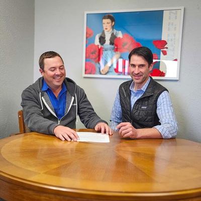 UbiQD CEO Hunter McDaniel (left), and newly appointed CFO Tony Beams (right) discussing debt financing deal terms. Courtesy of UbiQD.