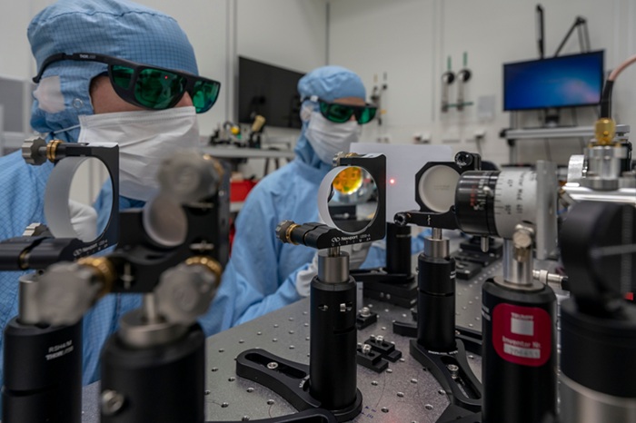 Technicians conduct mirror assembly in the TRUMPF clean room to produce an extreme ultraviolet laser system. Courtesy of TRUMPF