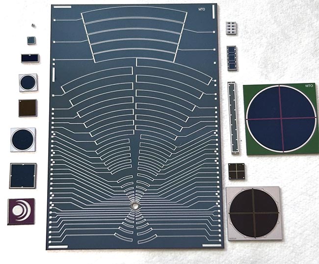 Single (left) and multiple-element silicon photodiodes, plus assorted linear arrays and quadrant photodiodes (right). The complex 65-element silicon photodiode (center) can be mounted on an aircraft wingtip to detect laser pulses bounced off ice particles to monitor particle size distribution. Courtesy of Opus Inspection.
