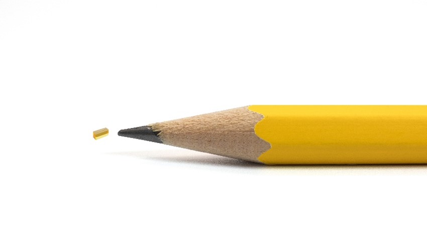 Figure 3. A microlens array made of EXTEM resin with 250-µm lens-to-lens pitch size, shown to scale.
