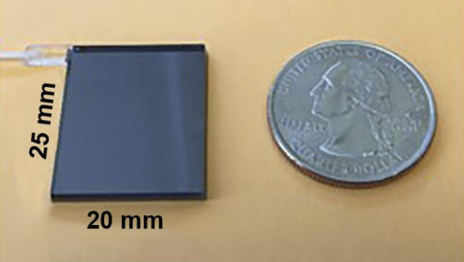 Figure 2. The first-generation eight-channel SDM-OCT chip measures 20 mm × 25 mm, approximately the size of a U.S. quarter. Adapted with permission from Reference 6.