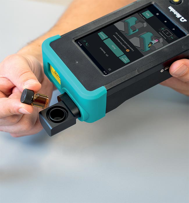 A hand-held Raman analyzer is used to measure through an opaque container to reliably identify gasoline (top). A liquid sample is placed into a vial holder accessory of a Raman analyzer for identification (middle). A Raman analyzer is used to determine the presence or absence of narcotics in a plastic bag (bottom). A right-angle sampling accessory allows the operator to contact the sample without exposure. Courtesy of Metrohm.