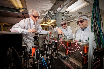 Researchers Sam Barber and Stephen Milton align the electron beamline made up of a series of steering magnets, quadrupoles, and high-resolution diagnostics. Credit of Lawrence Berkeley National Laboratory.