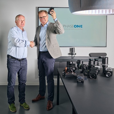 Henrik Håkonsson (left) hands over Phase One’s leadership to Arne Dehn (right). Courtesy of Phase One.